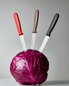 Nogent polypro paring knives about to cut through cabbage